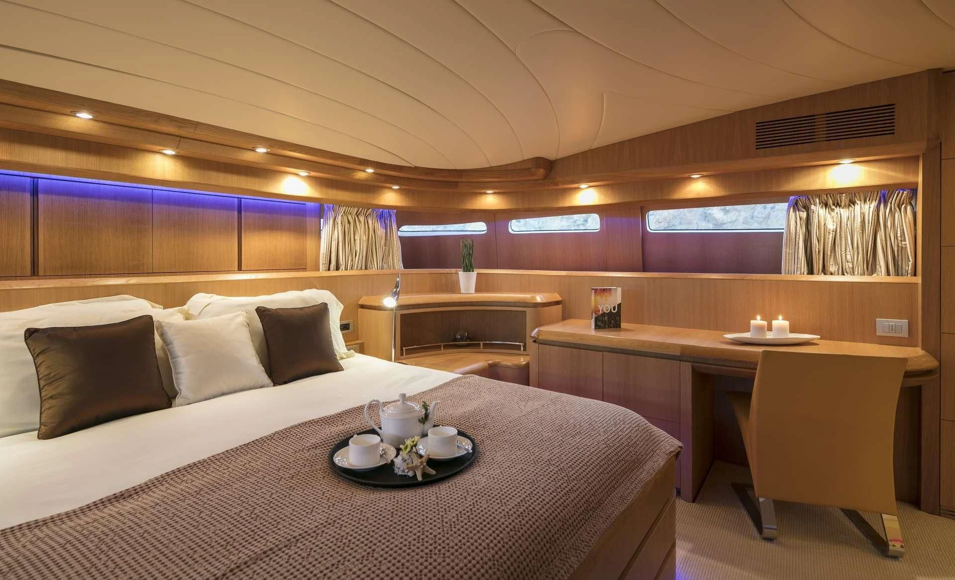 a room with a bed and a table aboard ANASA Yacht for Sale