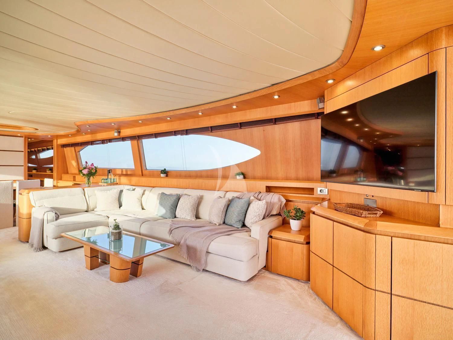 a living room with a couch and a table aboard ANASA Yacht for Sale