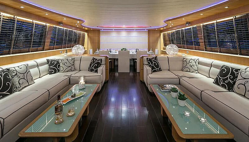 a living room with a couch and a table aboard ANASA Yacht for Sale
