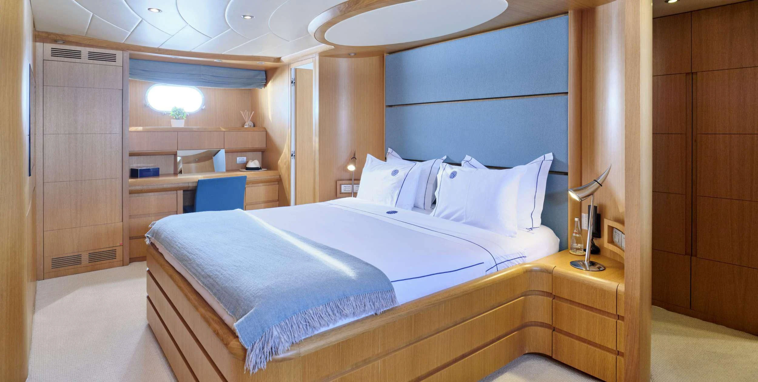 a room with a bed and a desk aboard ANASA Yacht for Sale