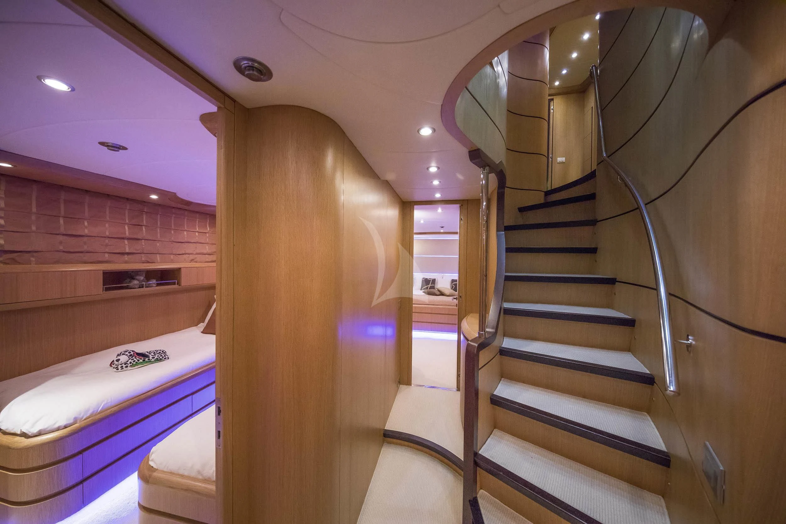 a staircase in a pink room aboard ANASA Yacht for Sale