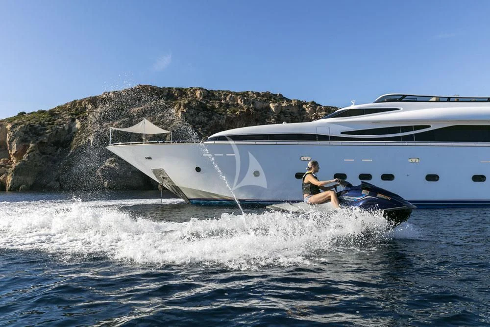 a man and a woman on a jet ski in the water aboard ANASA Yacht for Sale