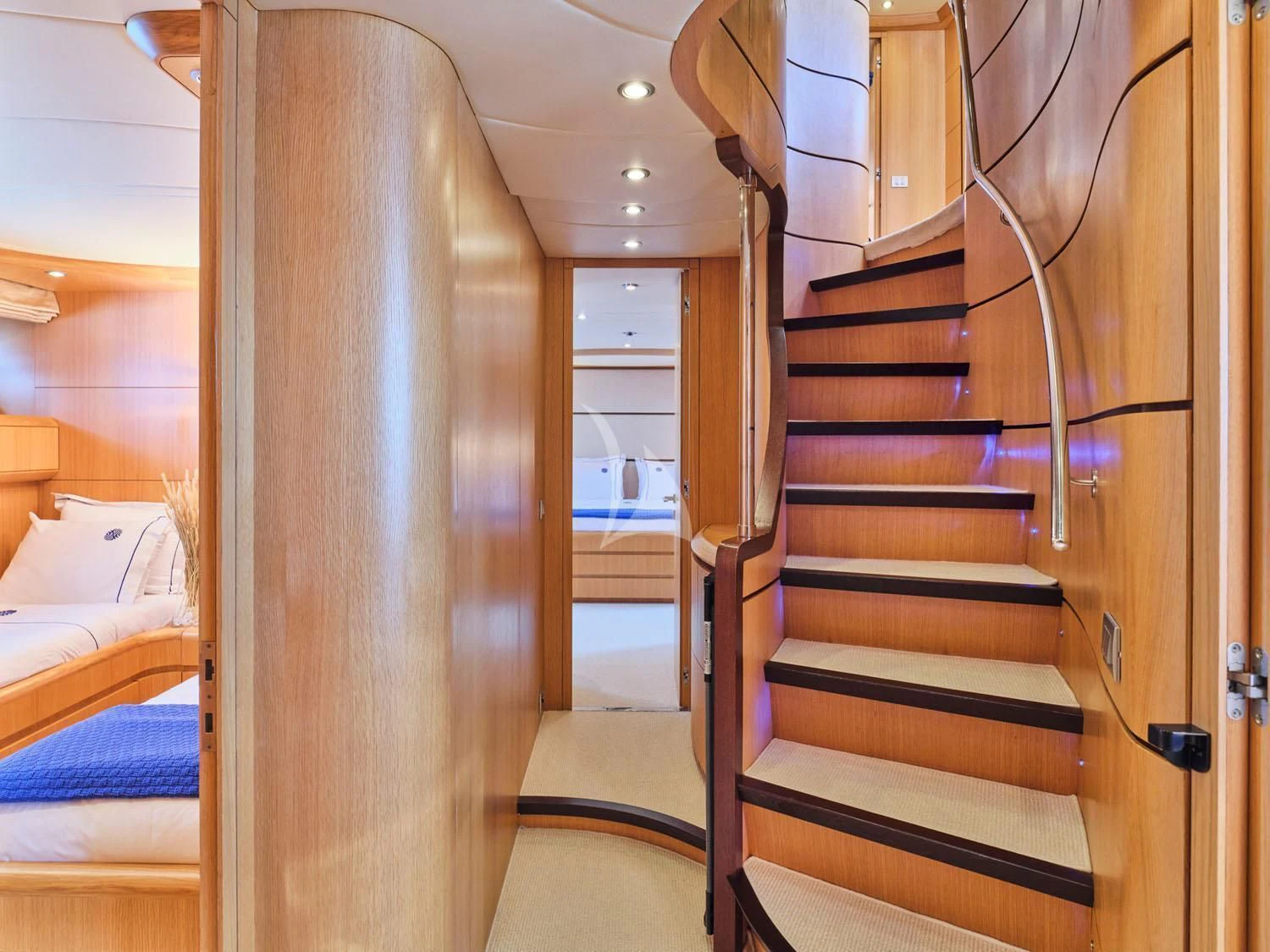 a wooden staircase in a room aboard ANASA Yacht for Sale
