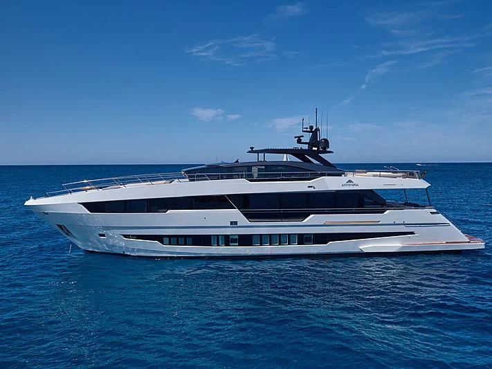 a white yacht in the water aboard NINITAS A Yacht for Sale