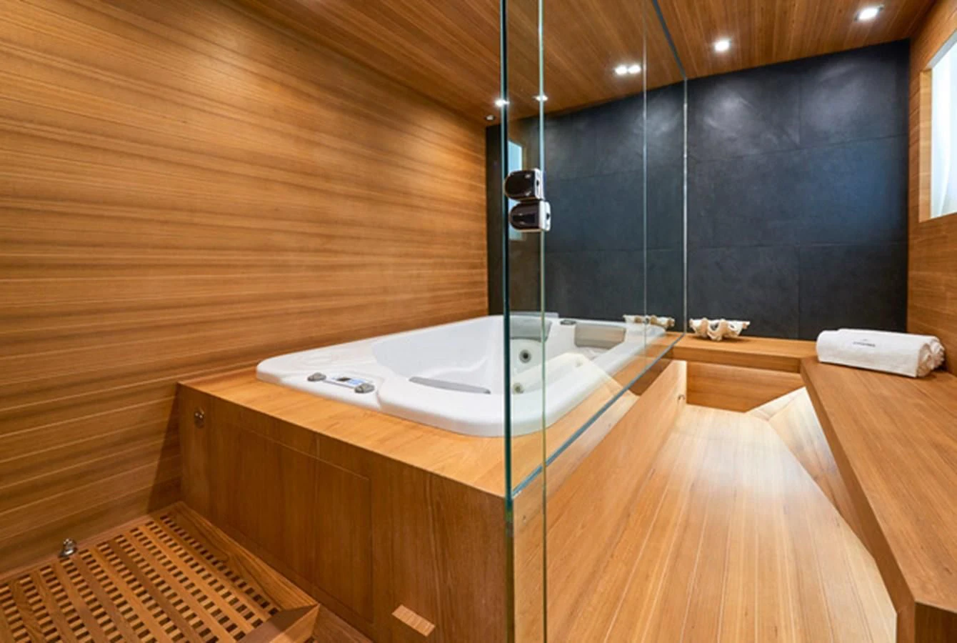 a bathroom with a tub aboard NINITAS A Yacht for Sale
