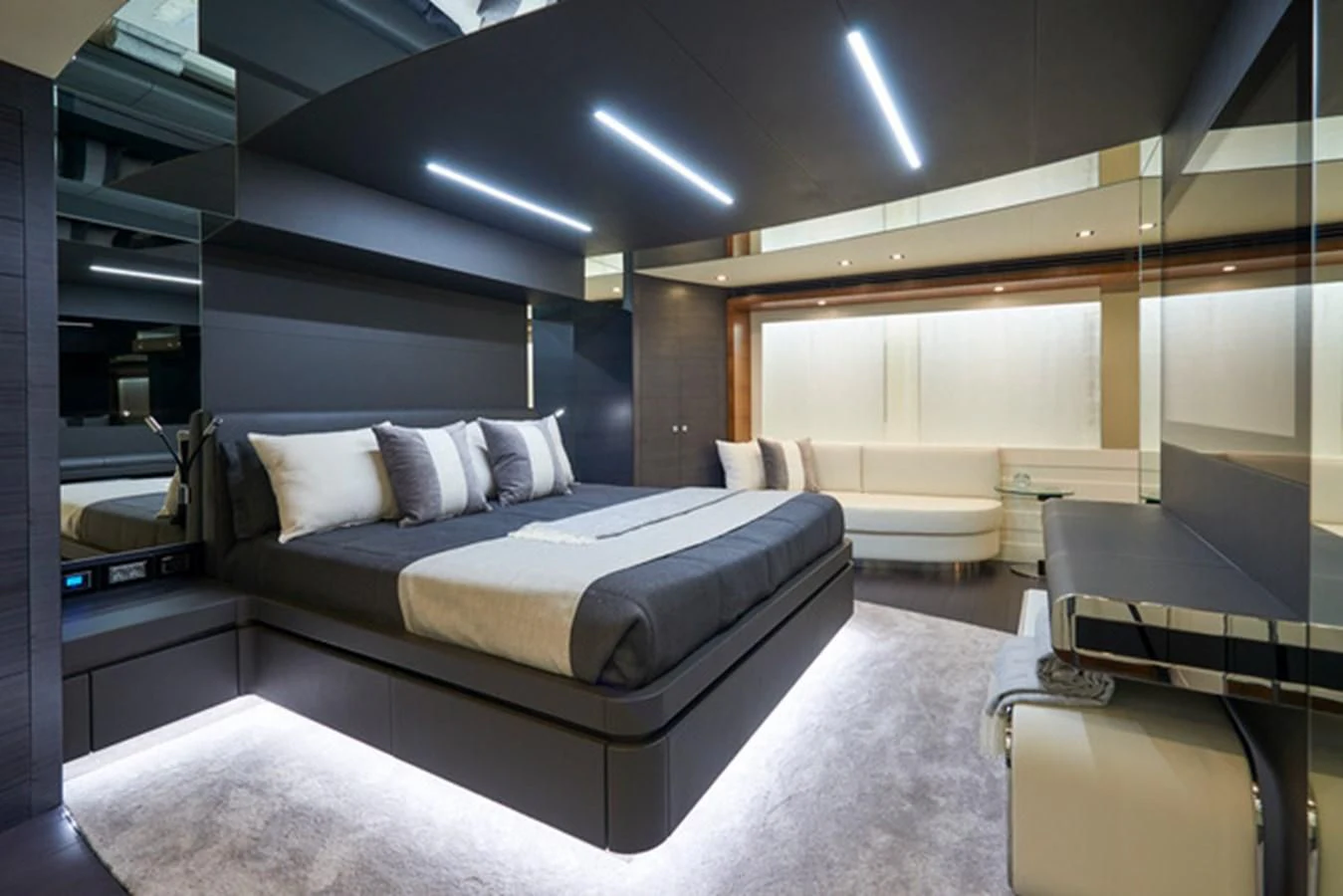 a room with a bed and a piano aboard NINITAS A Yacht for Sale