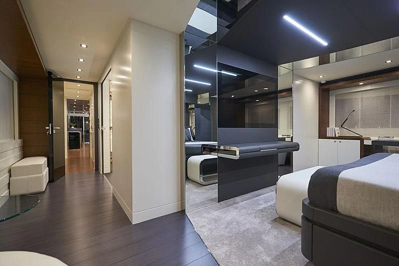 a room with a bed and a desk aboard NINITAS A Yacht for Sale
