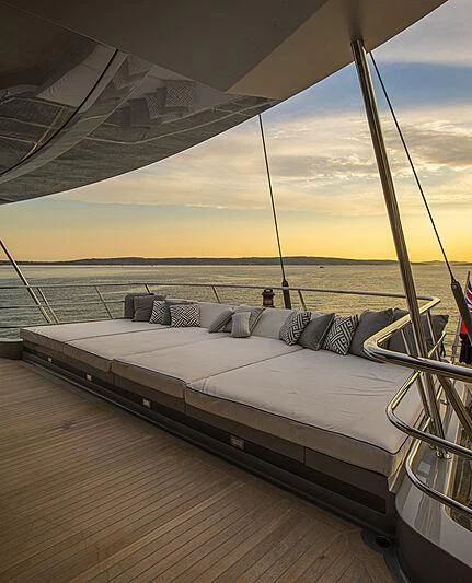 a bed on a deck aboard M5 Yacht for Sale