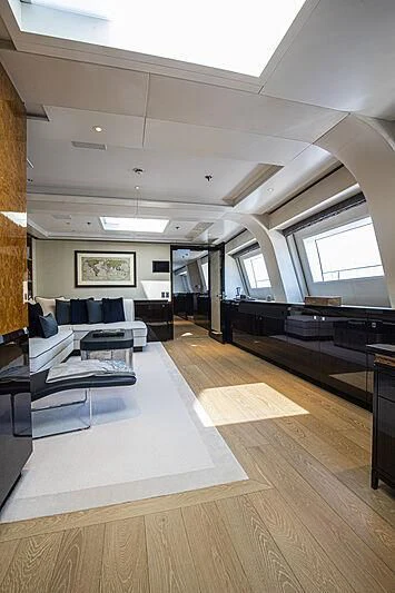 a room with a large window and a wood floor aboard M5 Yacht for Sale