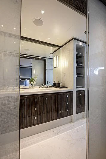 a bathroom with a large mirror aboard M5 Yacht for Sale