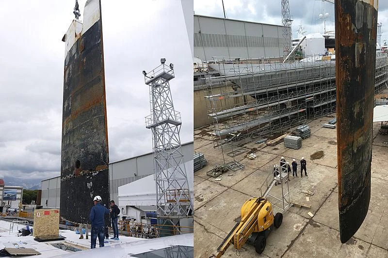 a crane next to a building aboard M5 Yacht for Sale