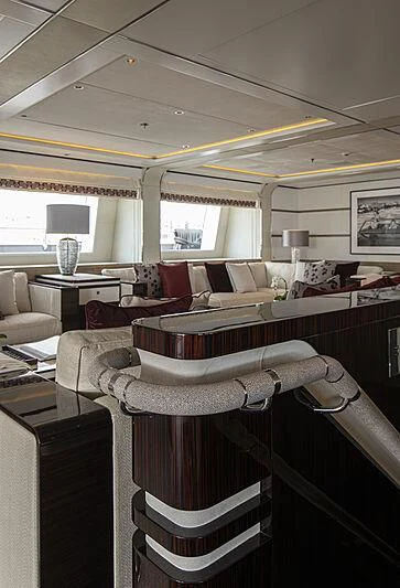 a living room with a couch and a table aboard M5 Yacht for Sale