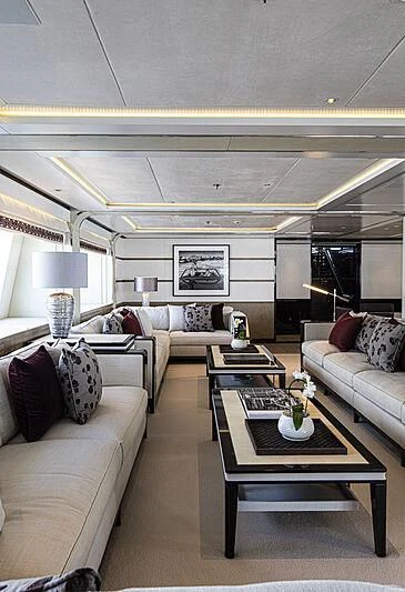 a living room with a couch and a coffee table aboard M5 Yacht for Sale