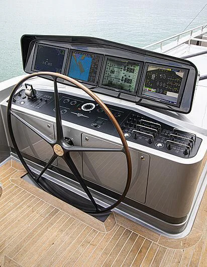 a black and silver console with a screen and buttons on it aboard M5 Yacht for Sale