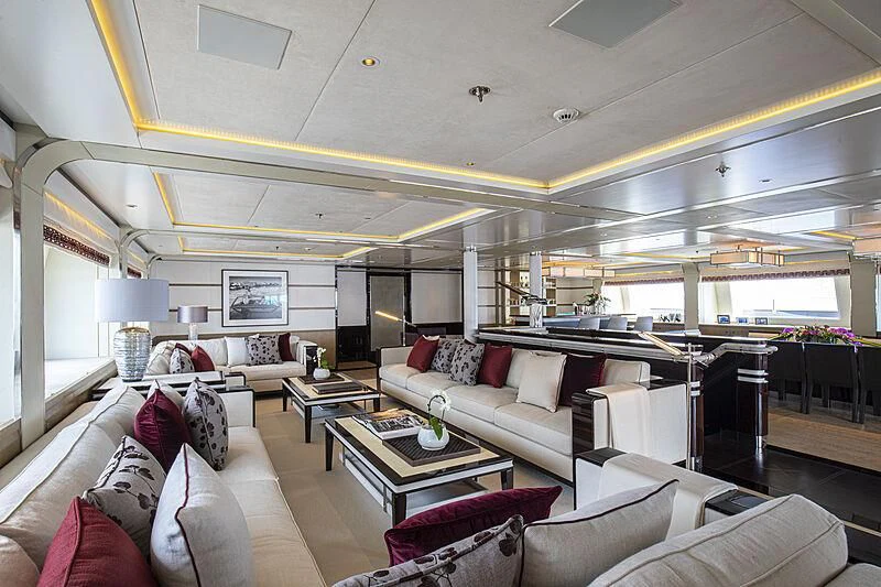 a living room with a large window aboard M5 Yacht for Sale
