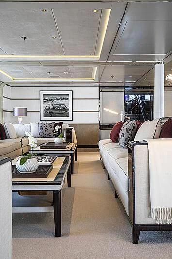 a living room with a couch and a coffee table aboard M5 Yacht for Sale