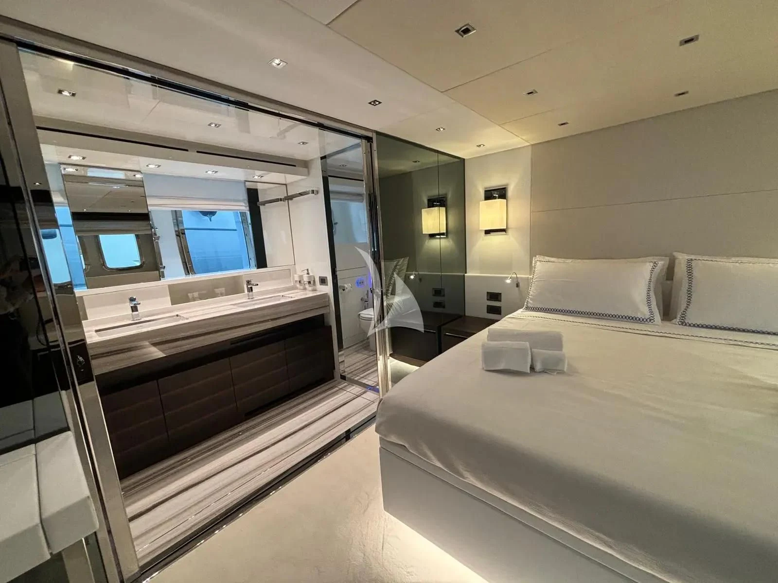 a room with a bed and a large mirror aboard QUEEN MARTINA Yacht for Sale