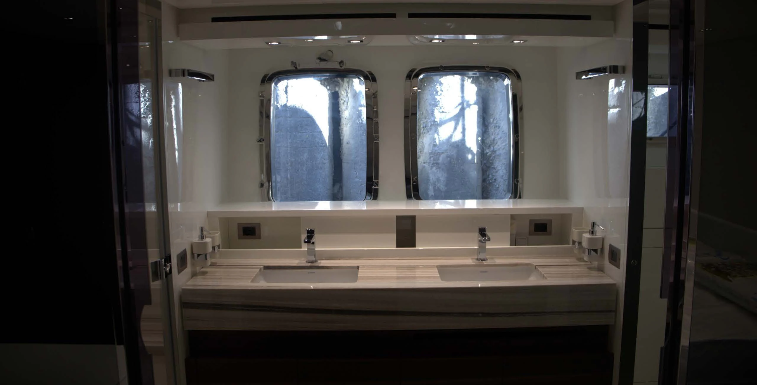 a bathroom with a large mirror aboard QUEEN MARTINA Yacht for Sale