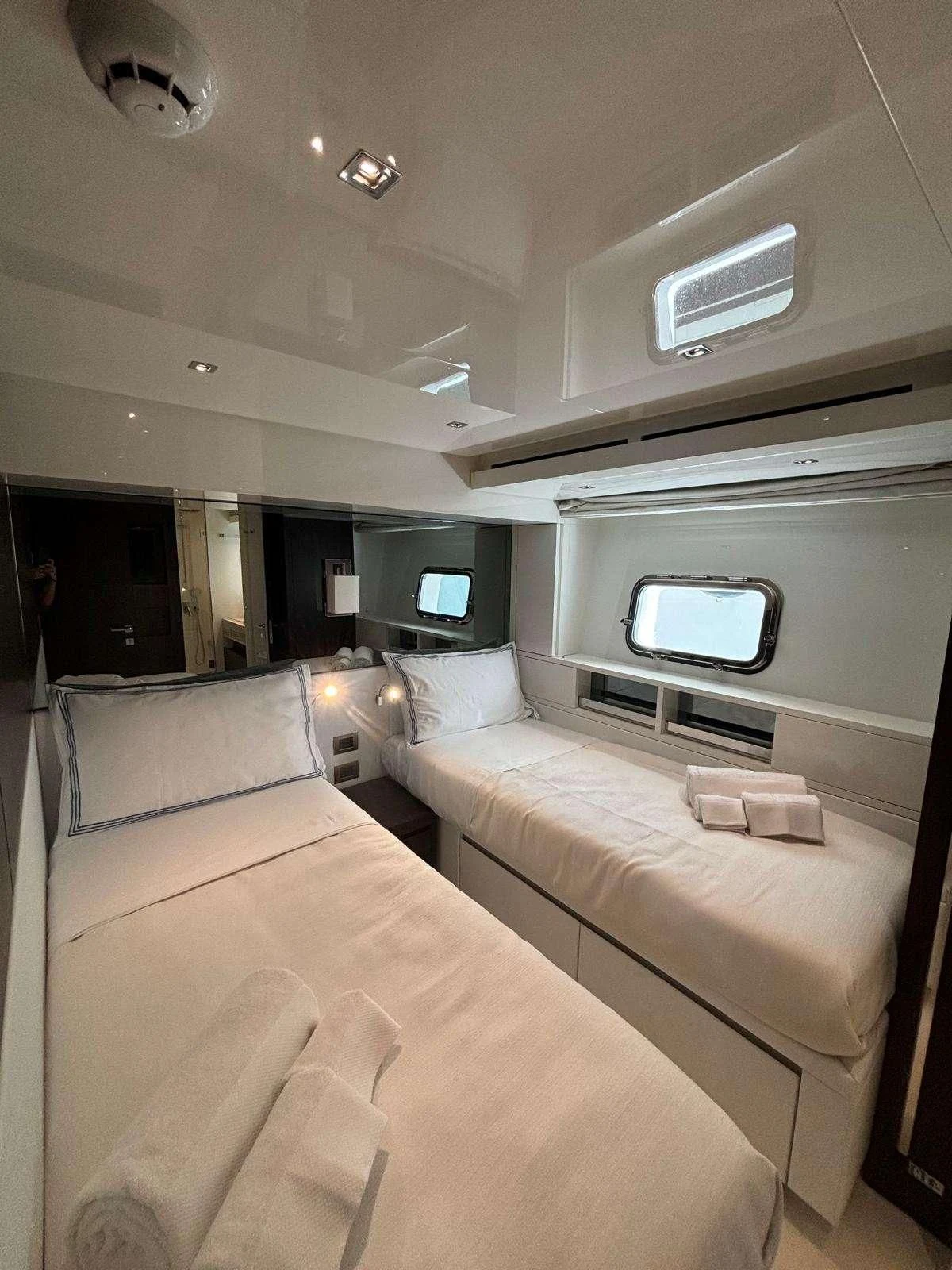 a room with a bed and a window aboard QUEEN MARTINA Yacht for Sale