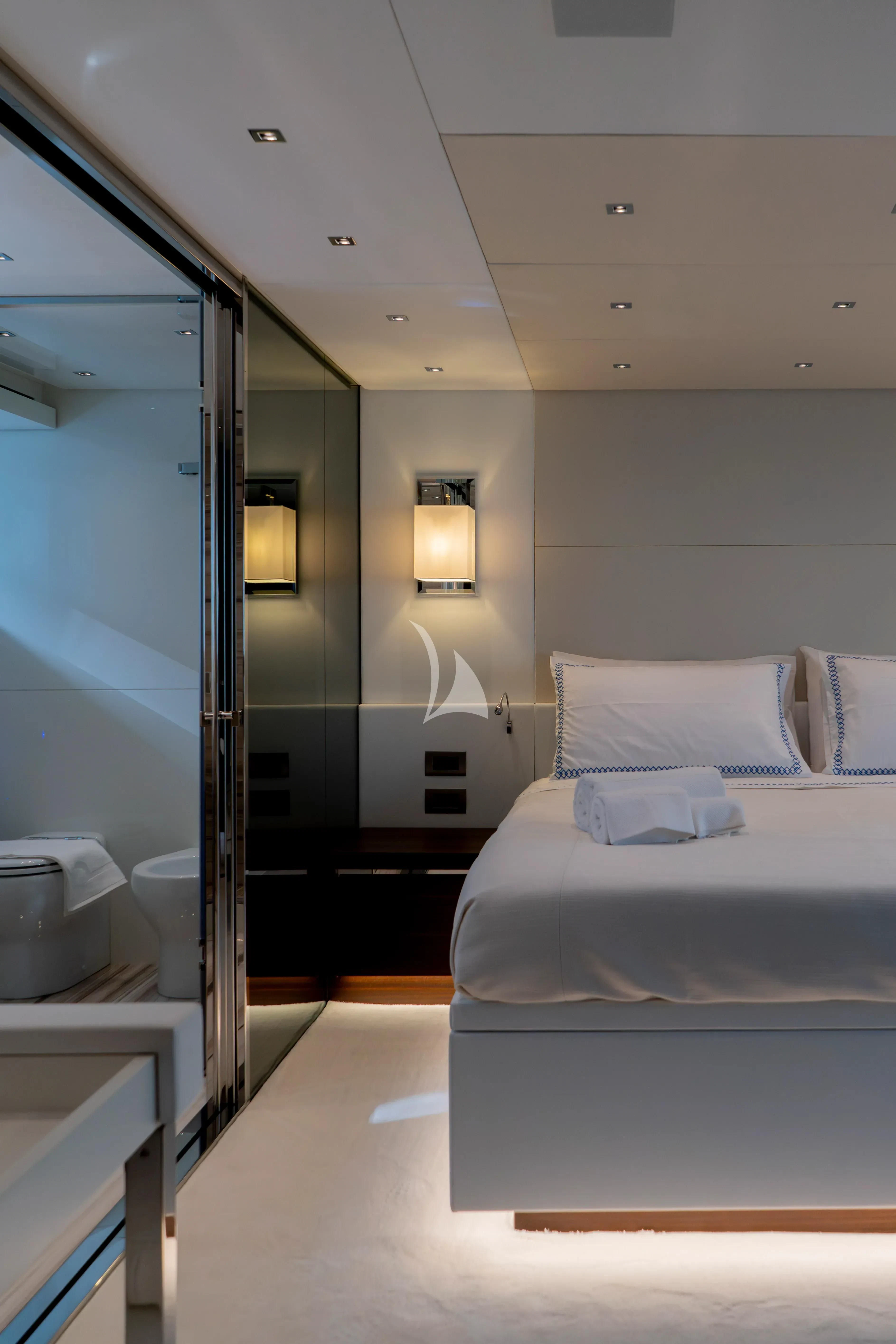 a room with a bed and a mirror aboard QUEEN MARTINA Yacht for Sale