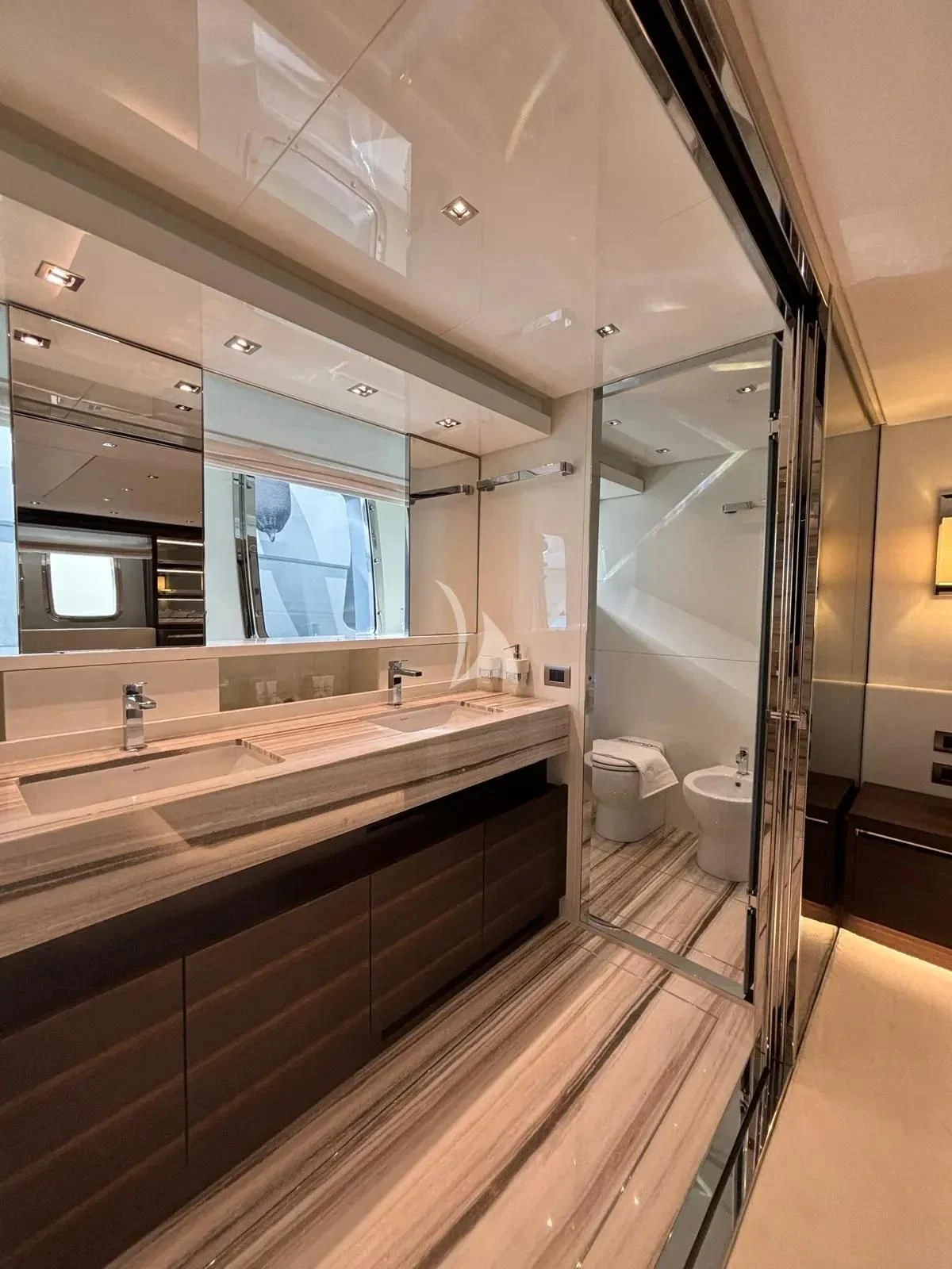 a bathroom with a large mirror aboard QUEEN MARTINA Yacht for Sale