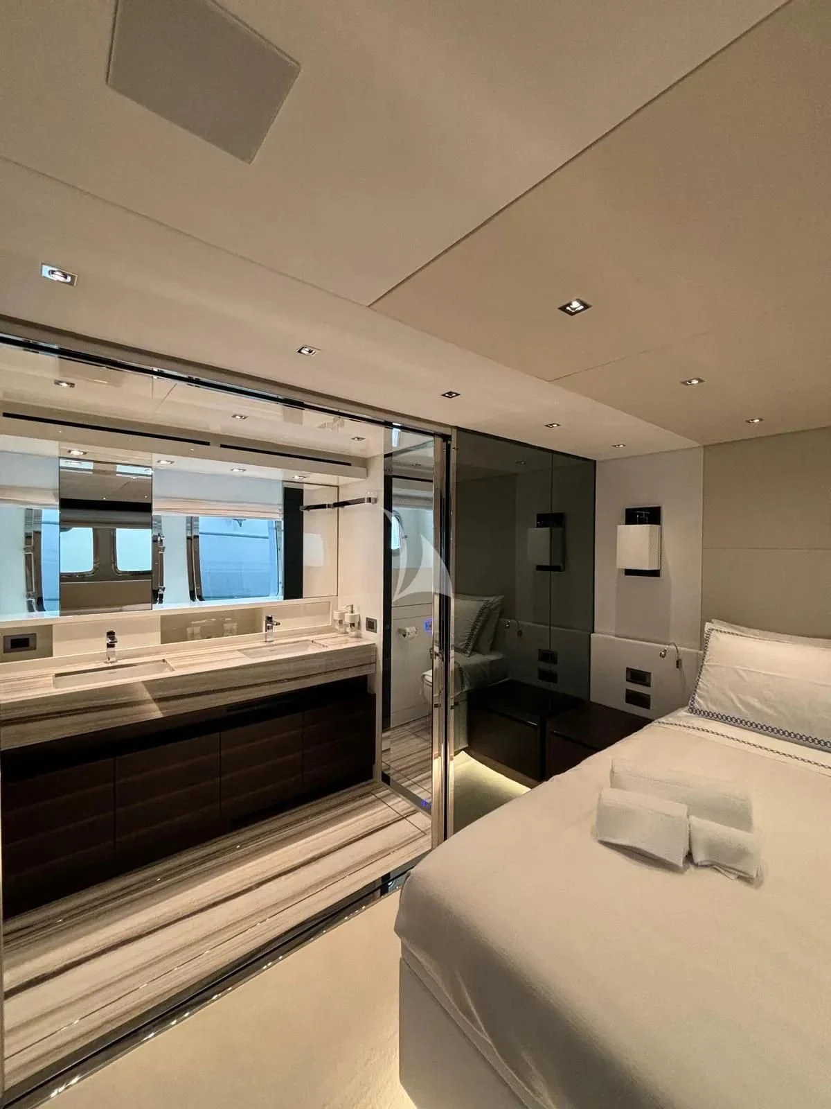 a modern bathroom with a large mirror aboard QUEEN MARTINA Yacht for Sale