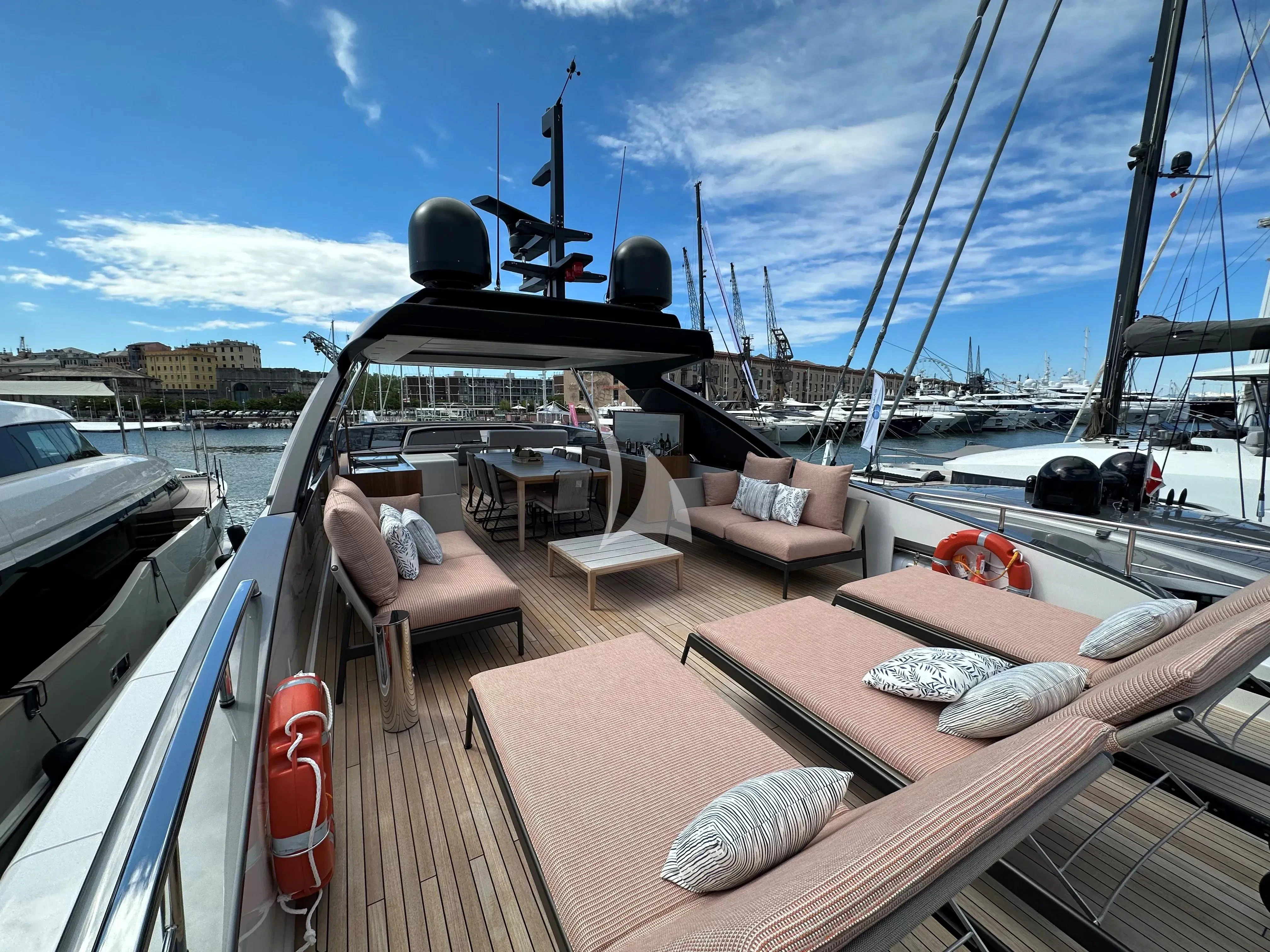 a deck with a boat and chairs on it aboard QUEEN MARTINA Yacht for Sale