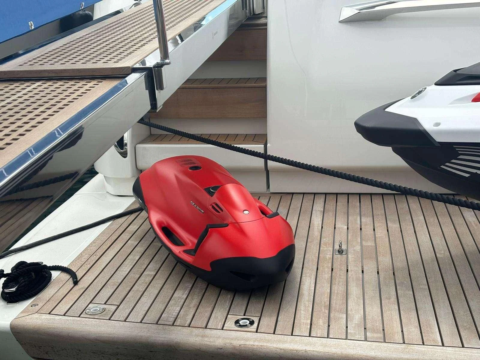 a red helmet on a wooden surface aboard QUEEN MARTINA Yacht for Sale