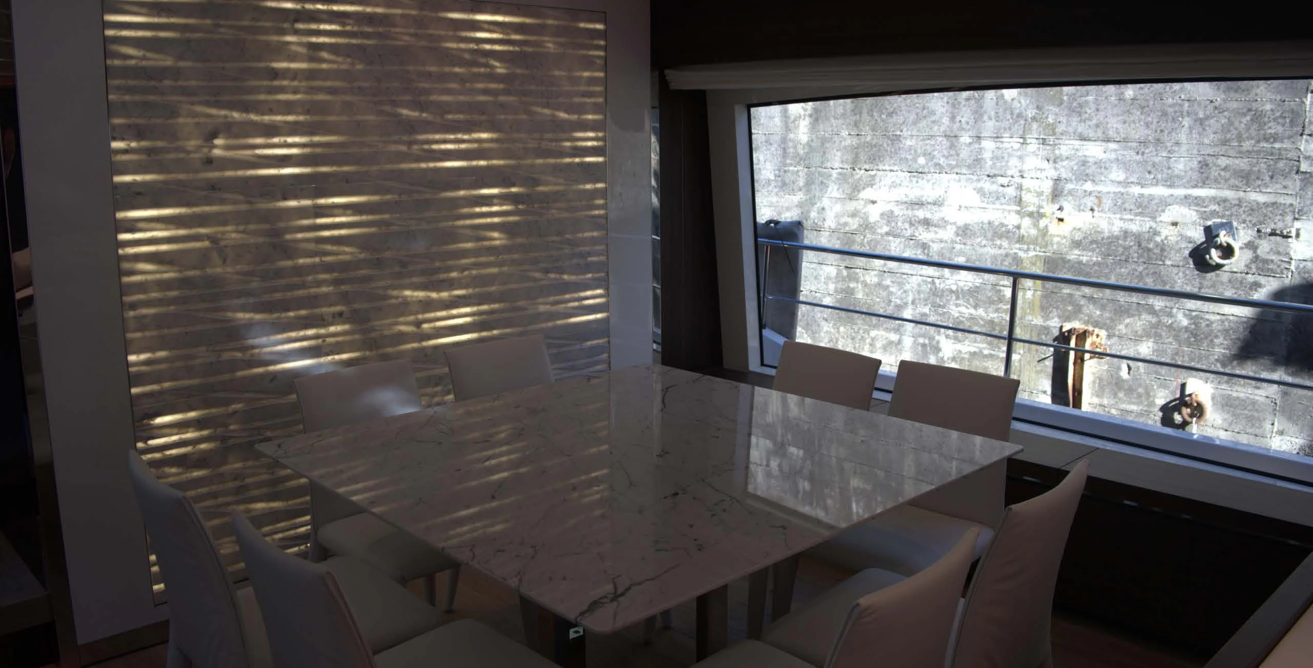 a room with a table and chairs aboard QUEEN MARTINA Yacht for Sale