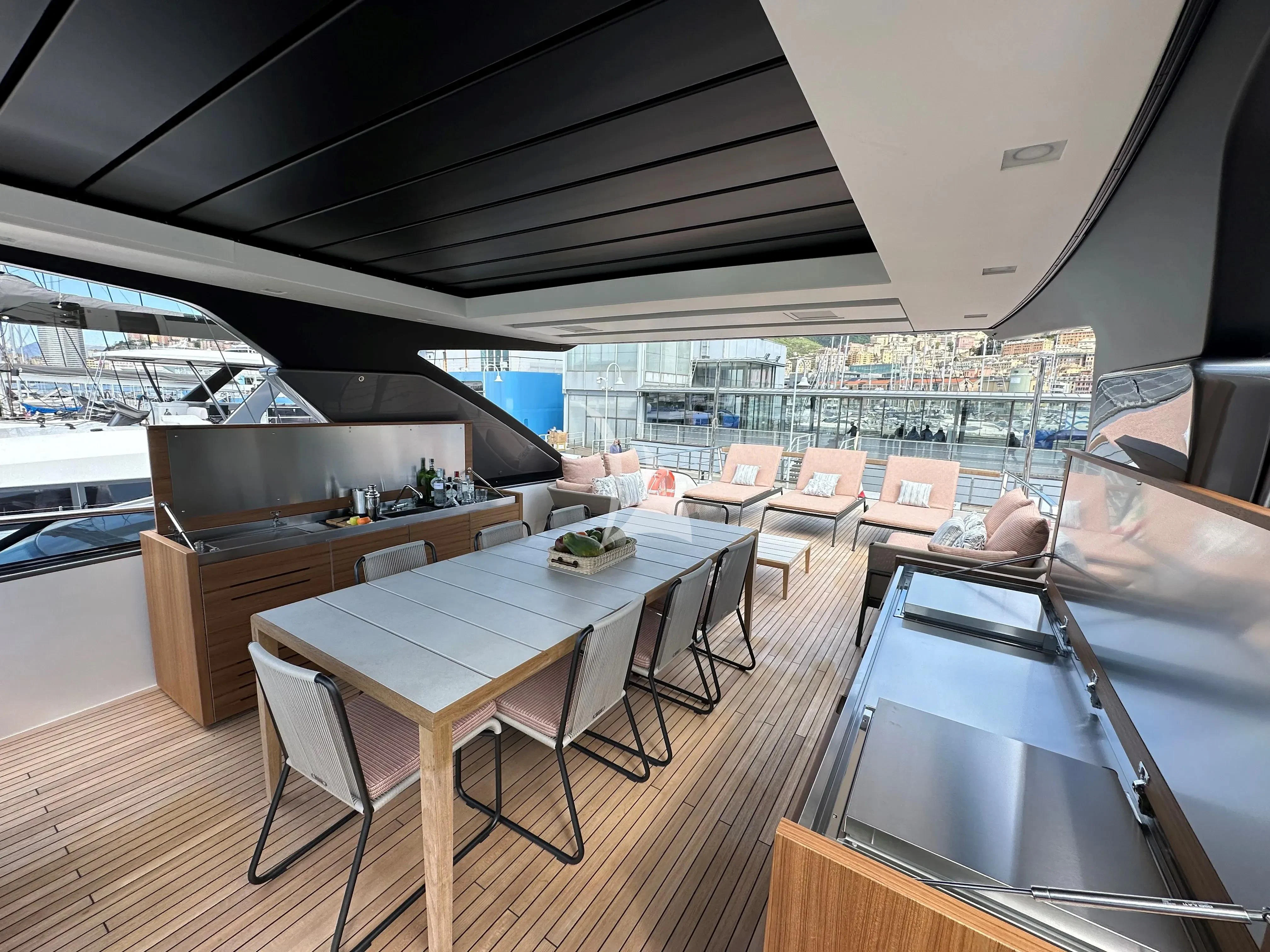 a room with tables and chairs aboard QUEEN MARTINA Yacht for Sale