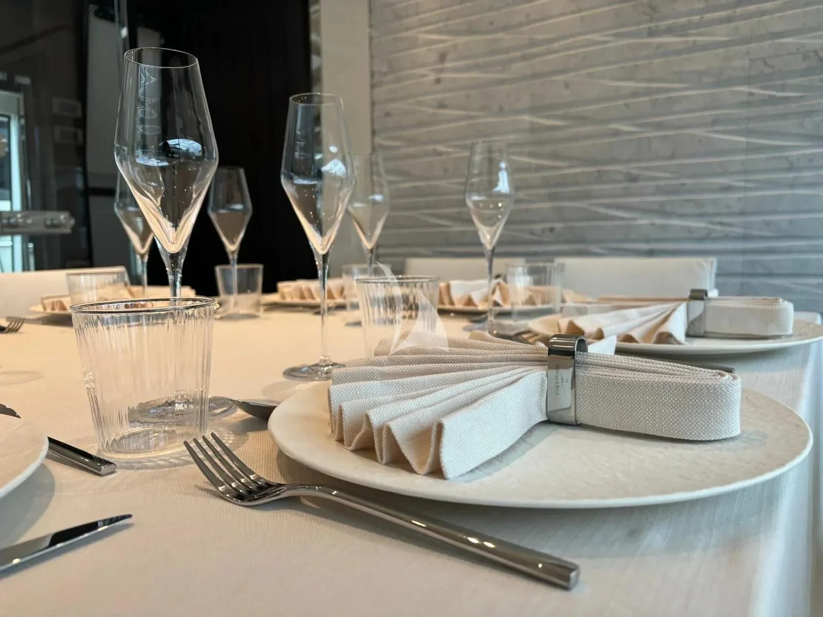 a plate of food and glasses aboard QUEEN MARTINA Yacht for Sale