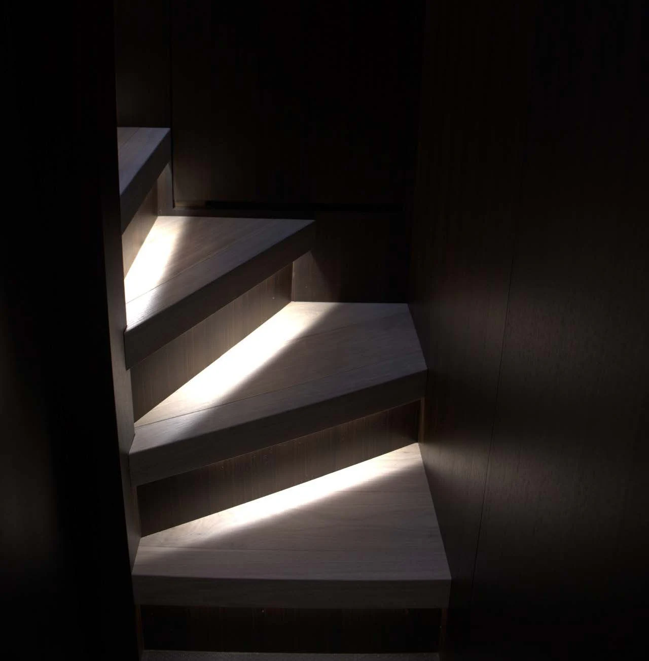 a set of stairs in a dark room aboard QUEEN MARTINA Yacht for Sale