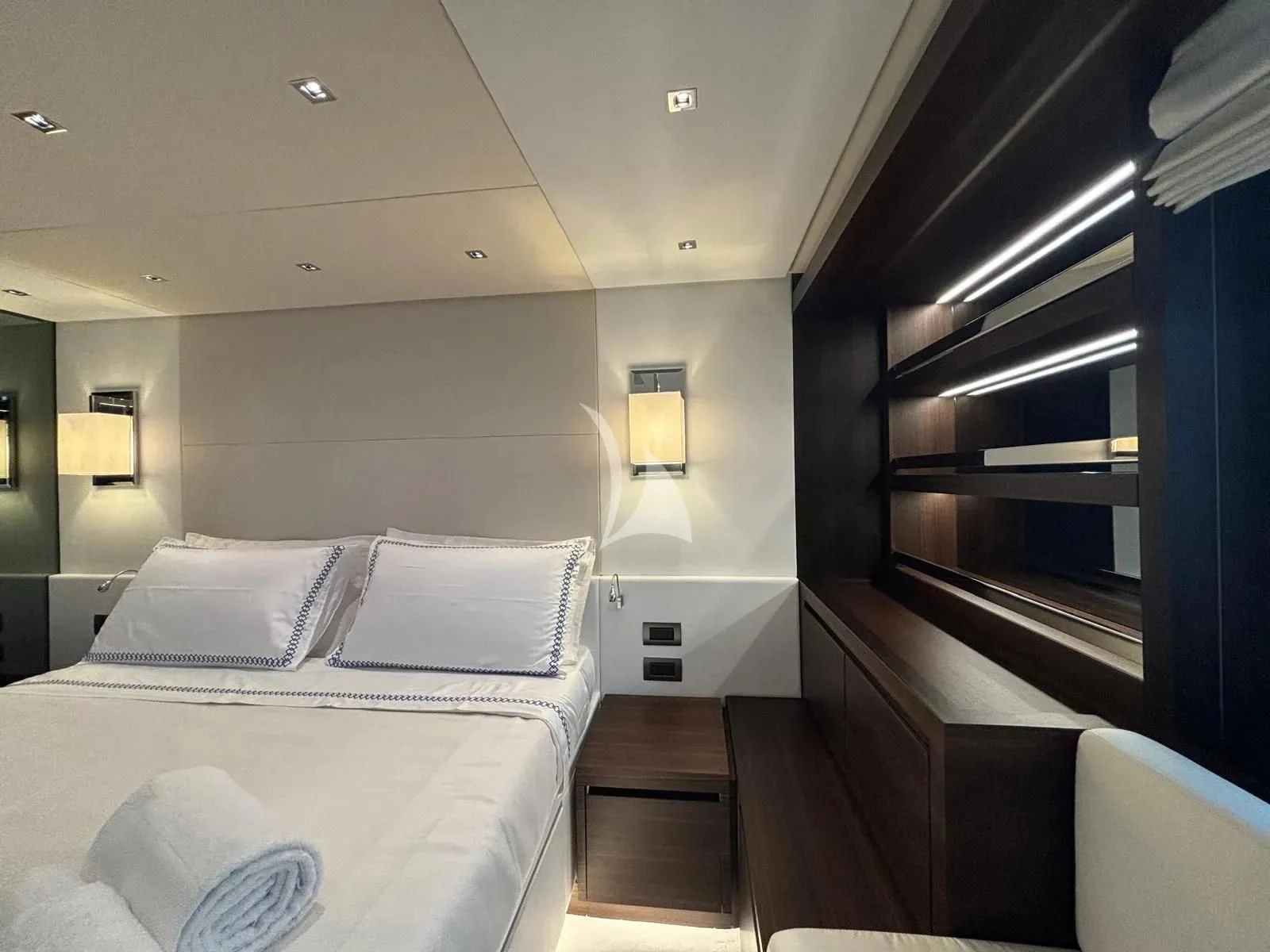 a room with a bed and a lamp aboard QUEEN MARTINA Yacht for Sale