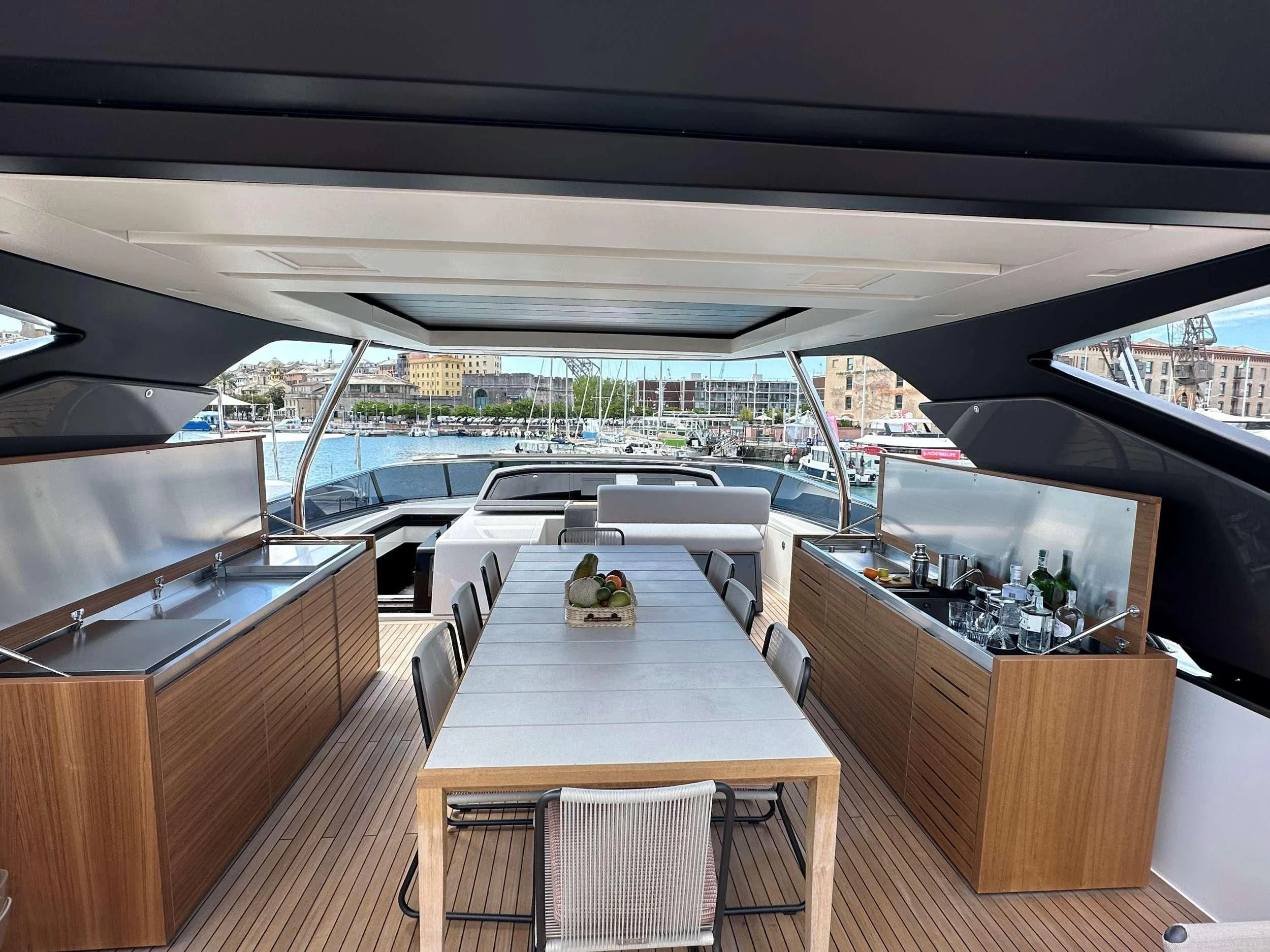 a room with a table and chairs aboard QUEEN MARTINA Yacht for Sale