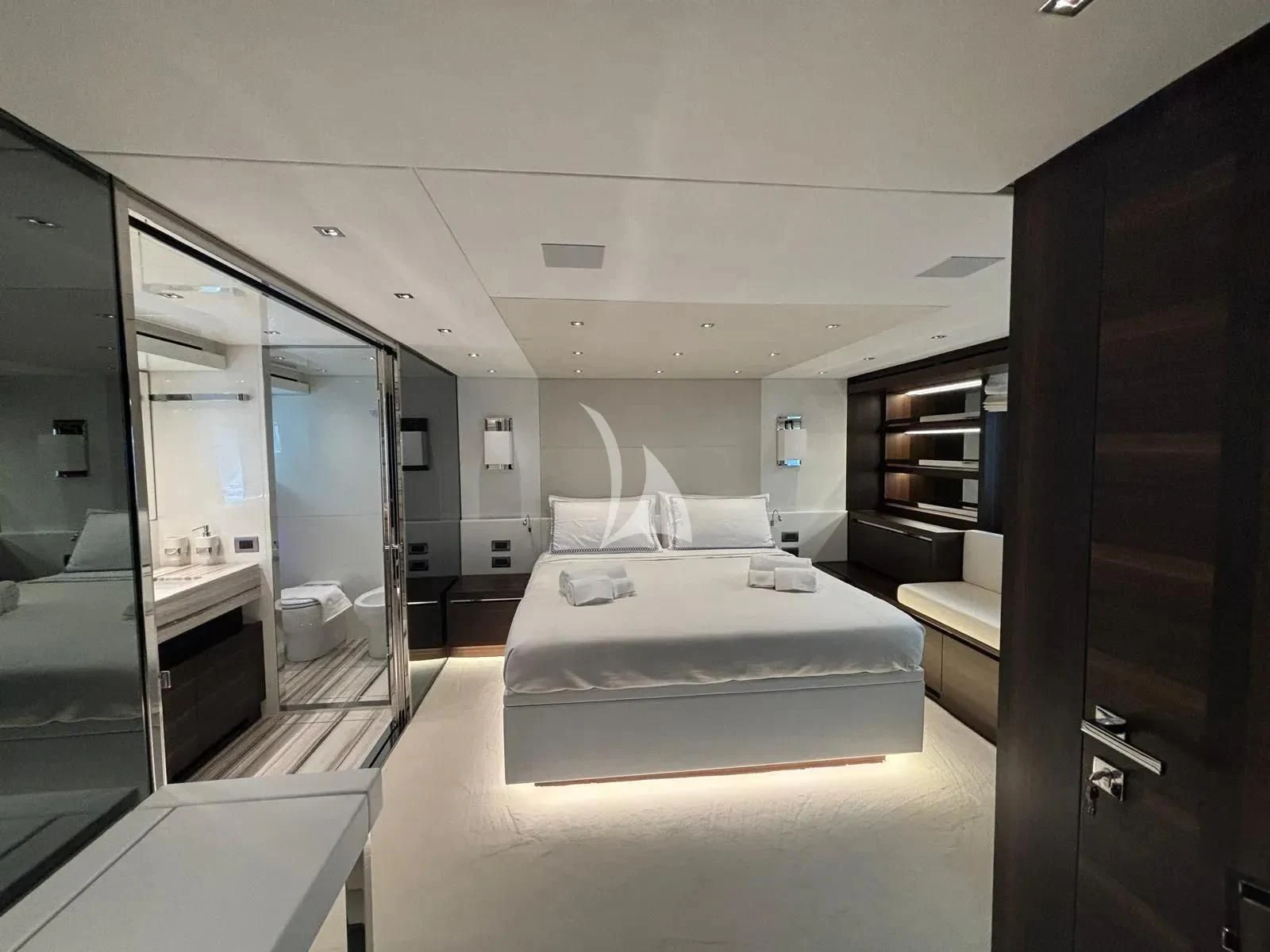 a room with a bed and a mirror aboard QUEEN MARTINA Yacht for Sale