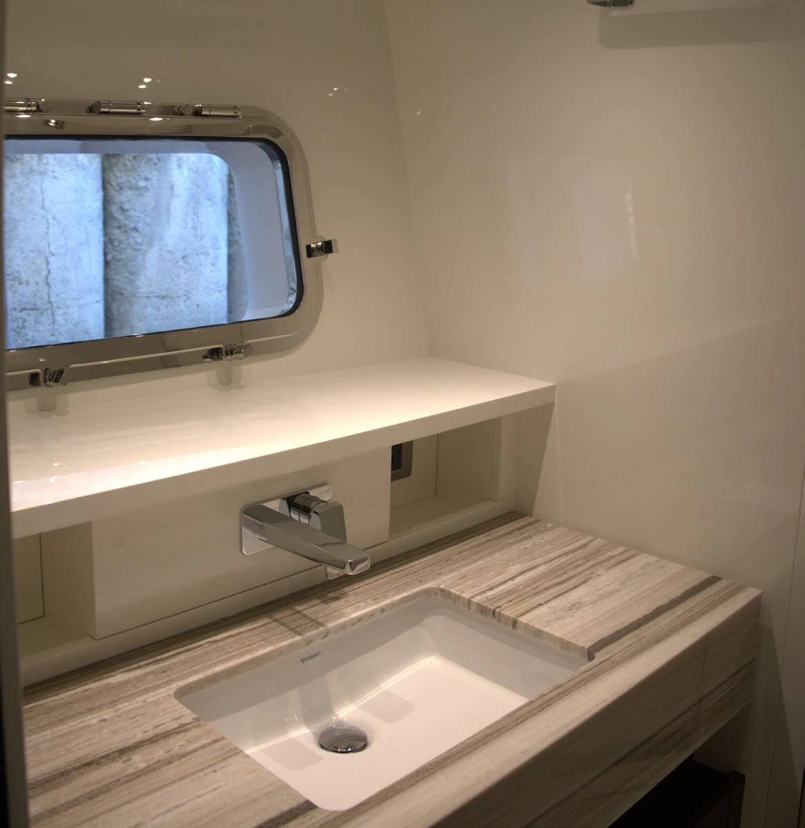a sink and a mirror in a bathroom aboard QUEEN MARTINA Yacht for Sale
