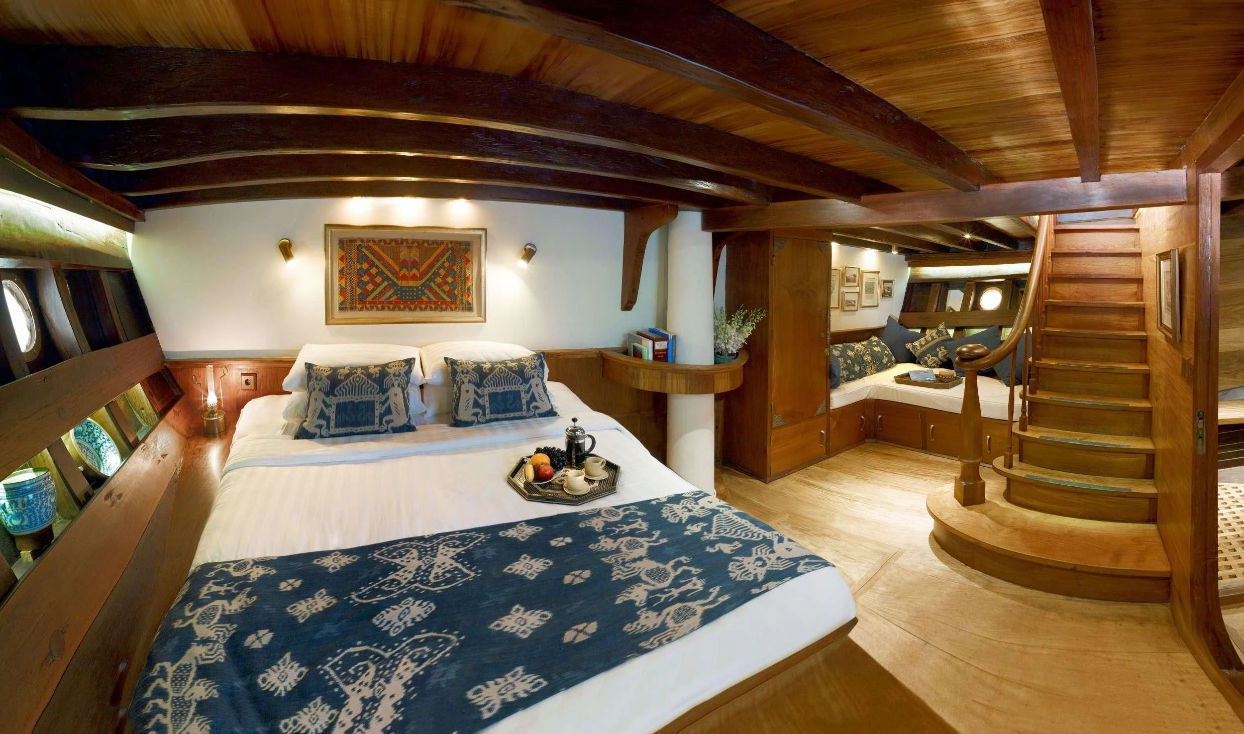 a bedroom with a large bed aboard SI DATU BUA Yacht for Sale