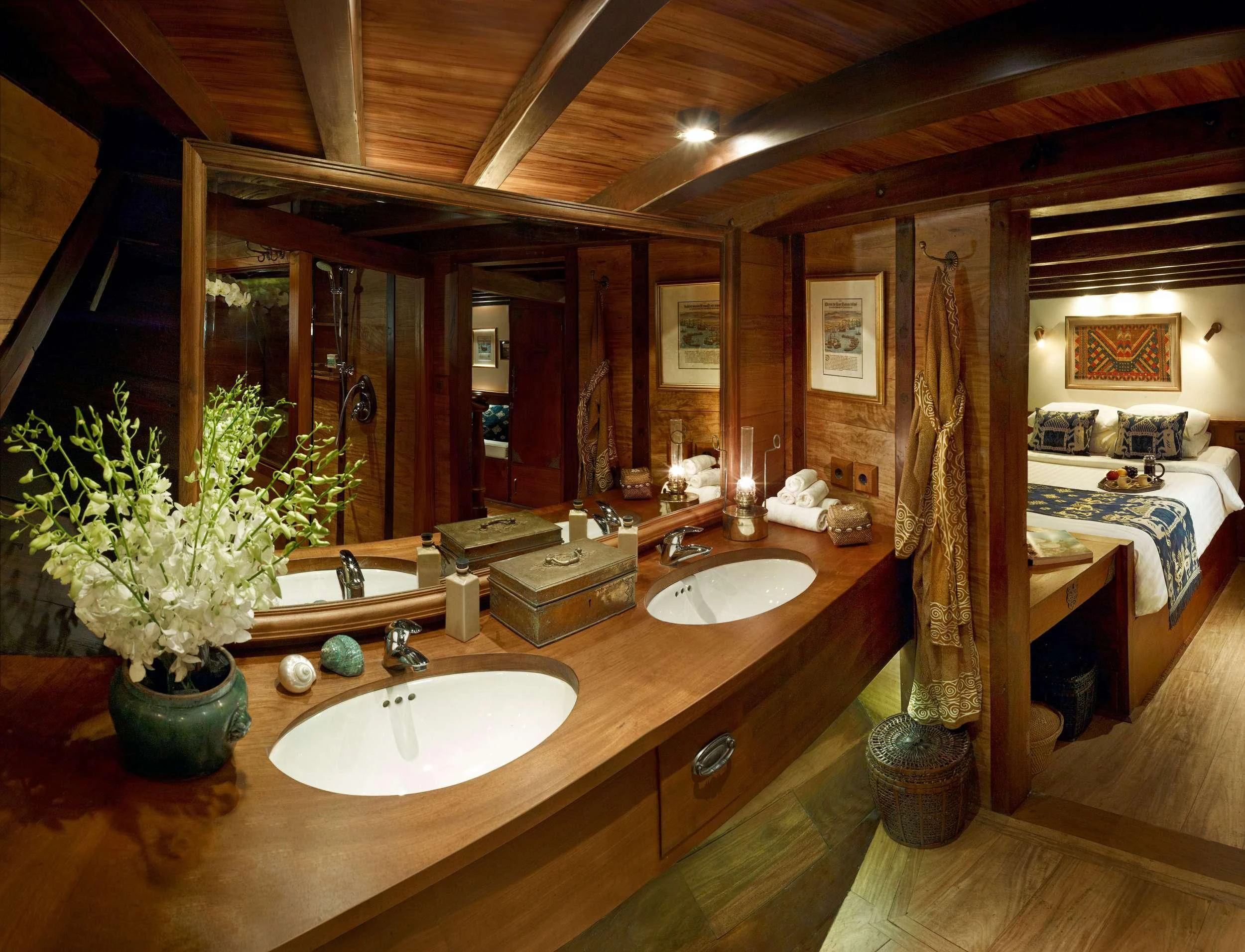 a bathroom with a large mirror aboard SI DATU BUA Yacht for Sale