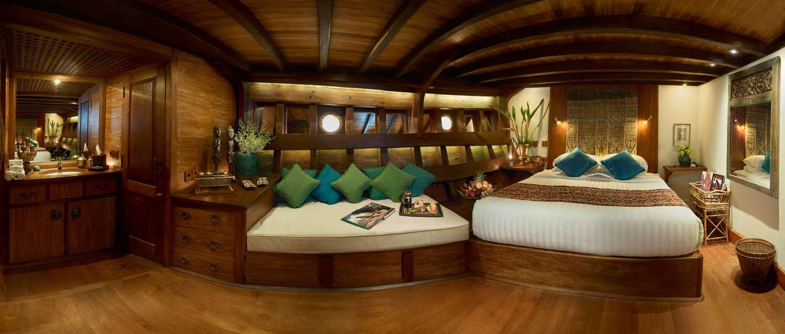 a large bedroom with a large bed aboard SI DATU BUA Yacht for Sale