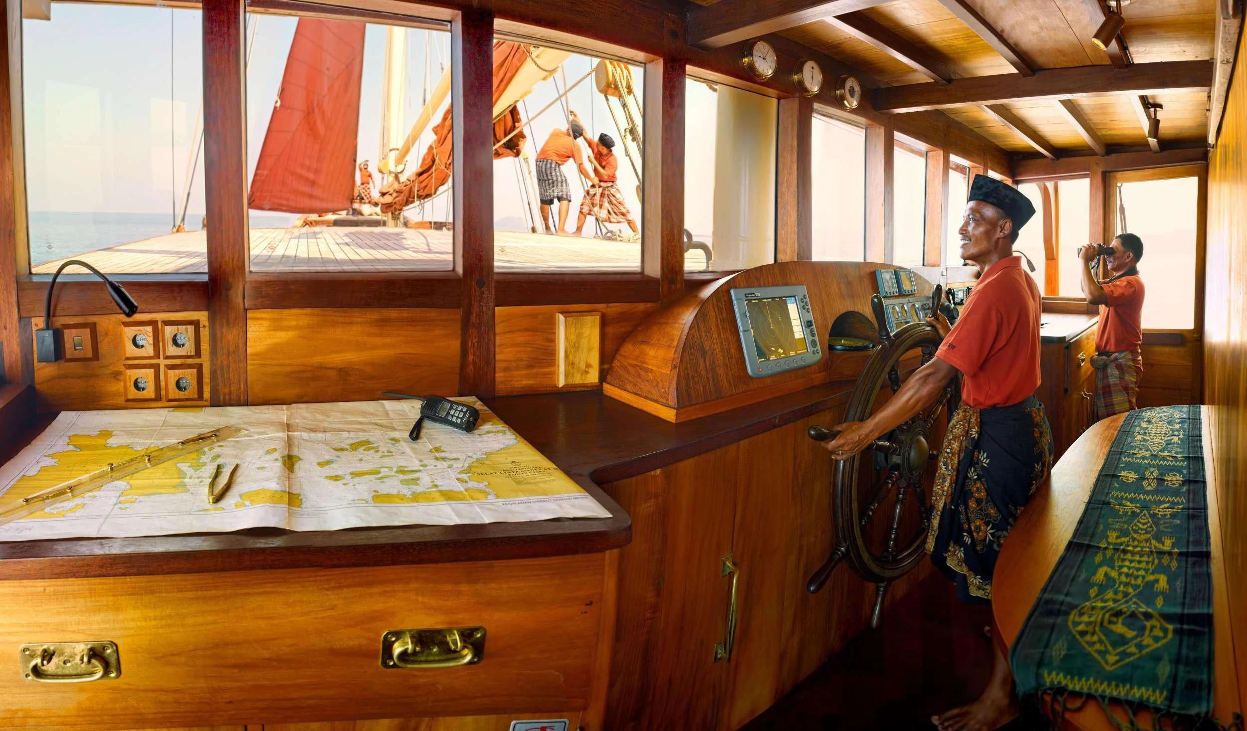 a group of people in a room aboard SI DATU BUA Yacht for Sale