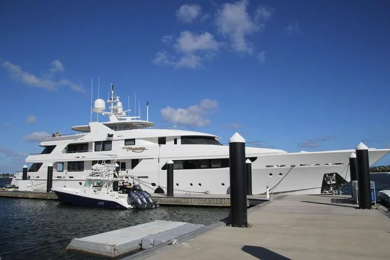 a large white boat docked at a dock aboard SECOND LOVE Yacht for Charter