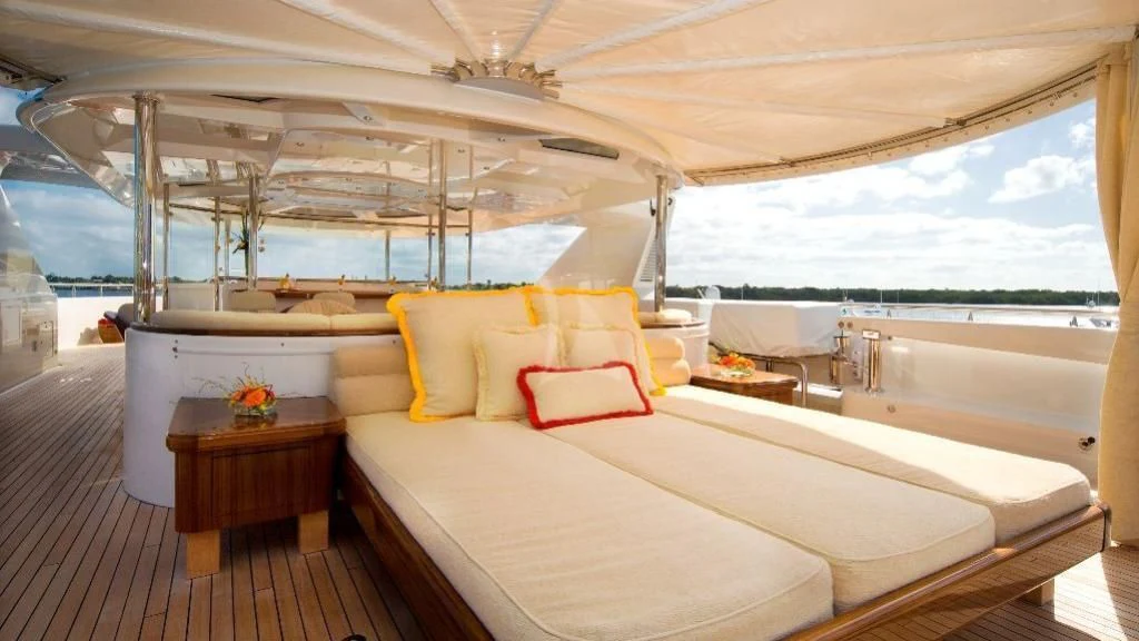 a room with a bed and a table aboard SECOND LOVE Yacht for Charter