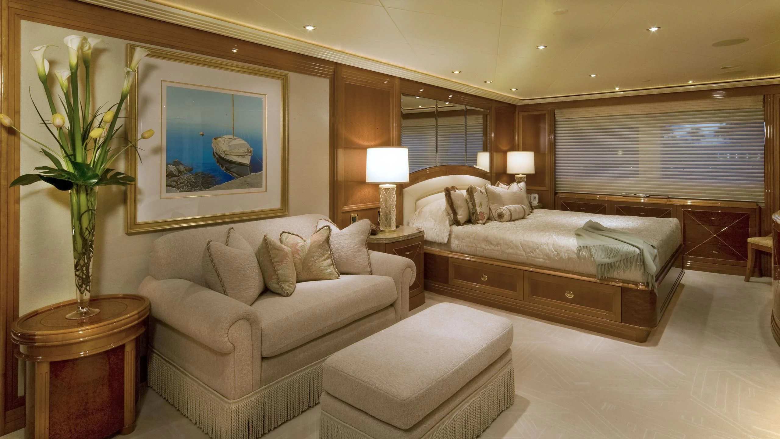 a large bedroom with a bed and a couch aboard SECOND LOVE Yacht for Charter