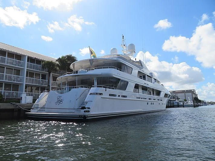 a large white boat in a harbor aboard SECOND LOVE Yacht for Charter