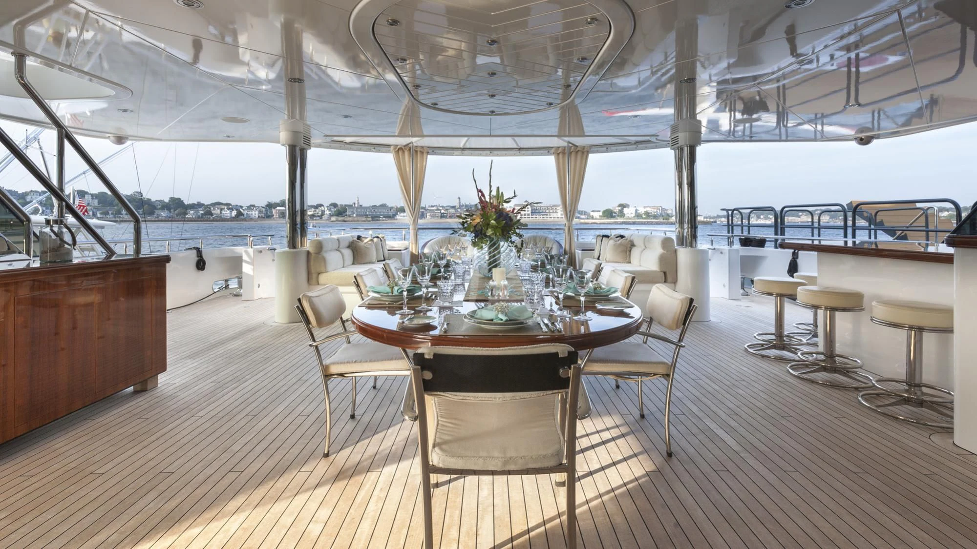 a room with tables and chairs aboard SECOND LOVE Yacht for Charter