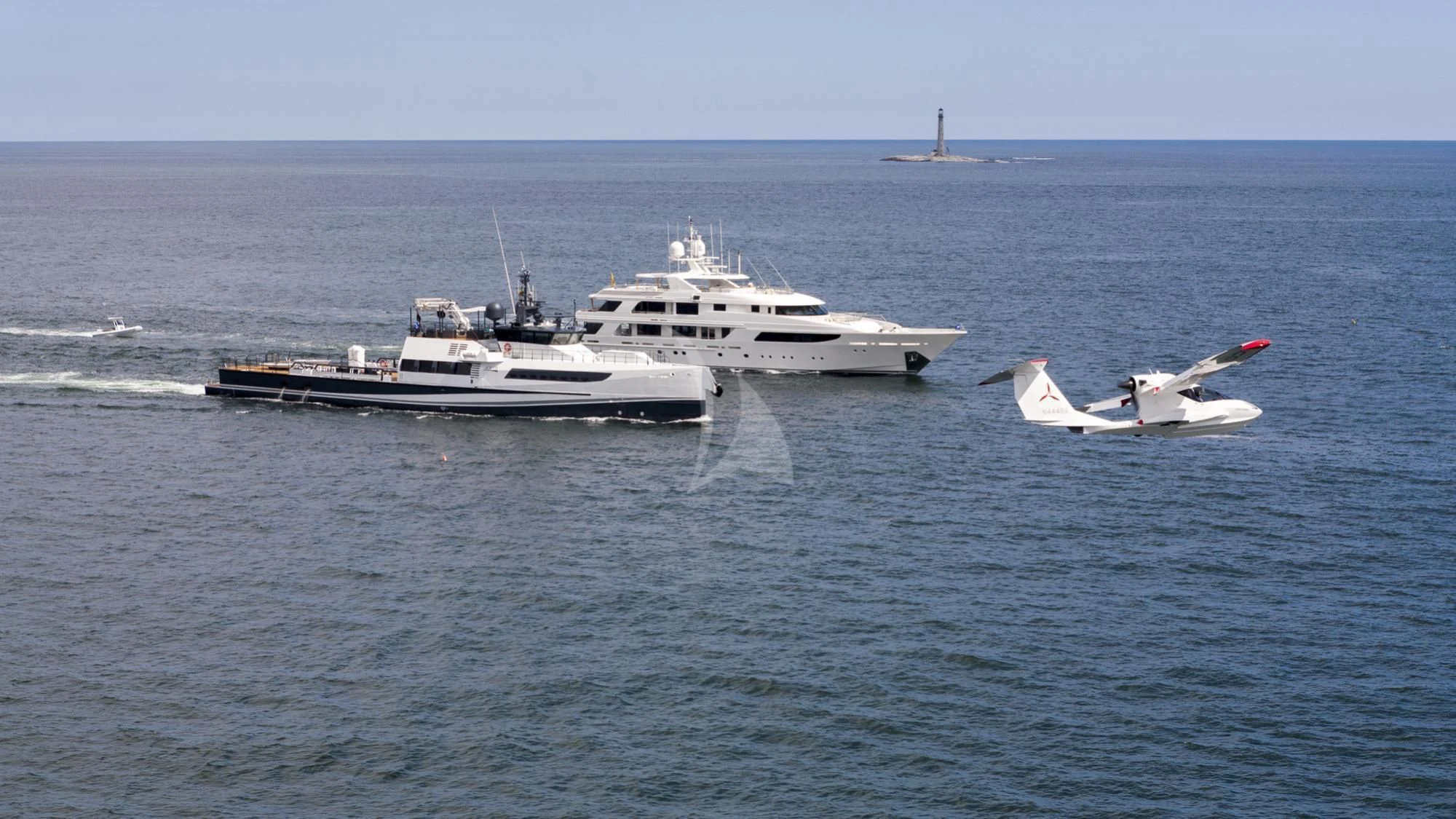 a plane flying over a boat in the ocean aboard SECOND LOVE Yacht for Charter