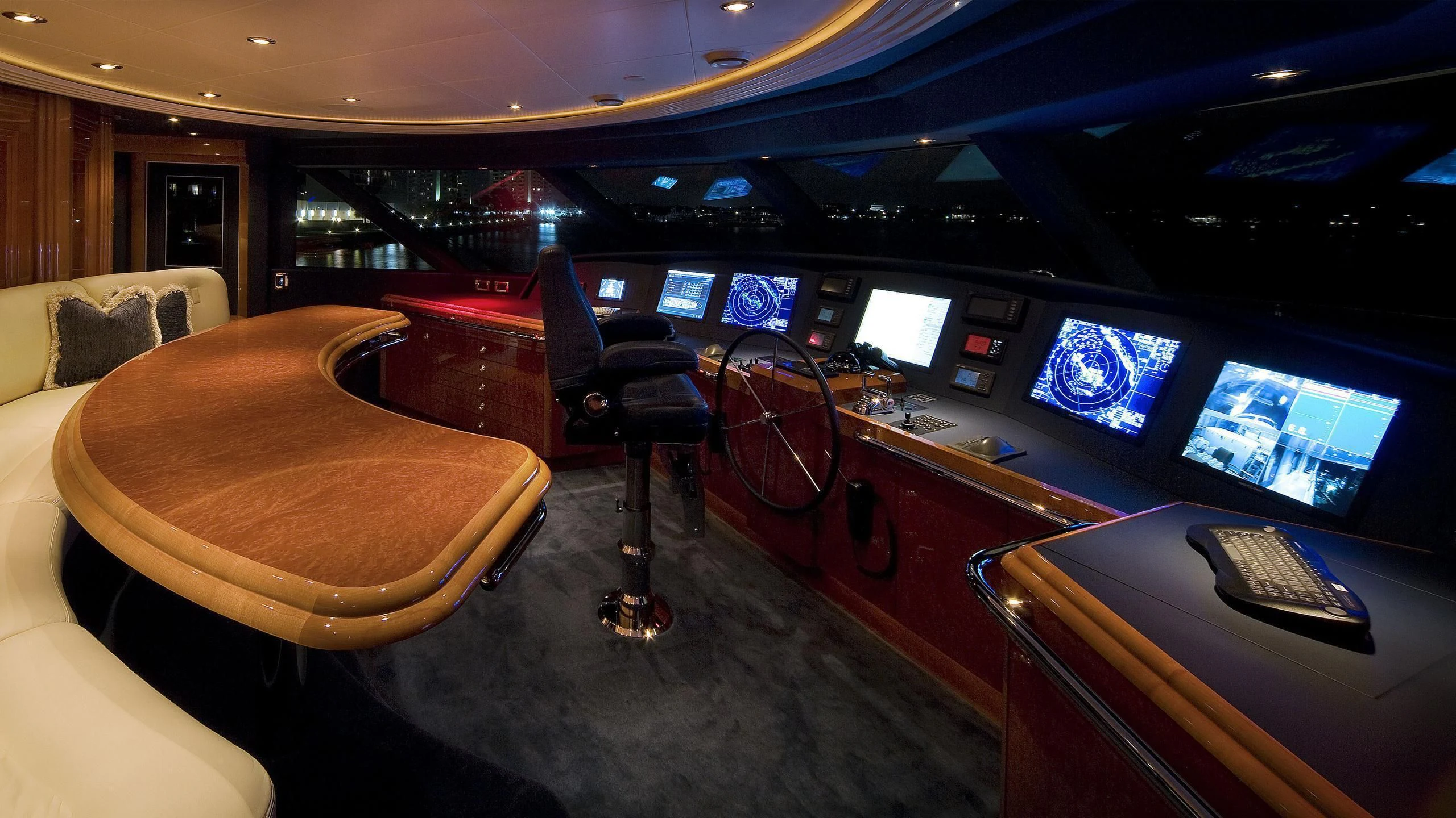a room with a couch and a desk with a computer on it aboard SECOND LOVE Yacht for Charter