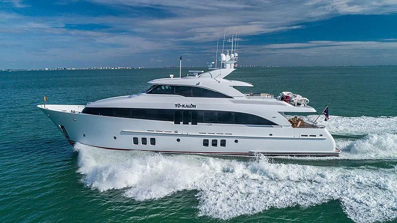 a white yacht on the water aboard INDULGENCE Yacht for Sale