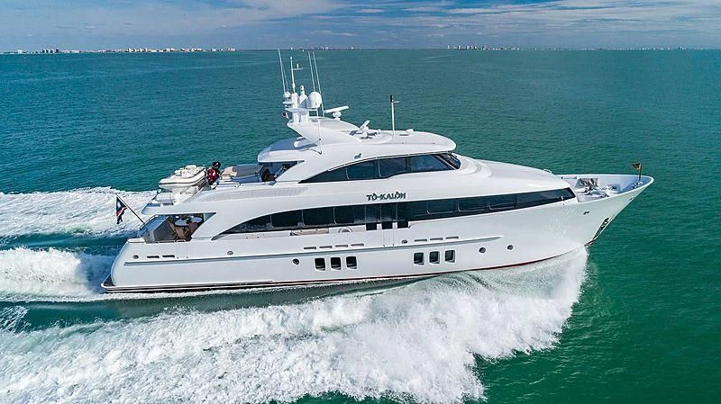 a white yacht on the water aboard INDULGENCE Yacht for Sale