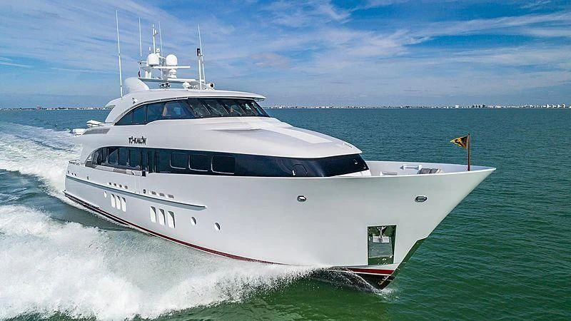 a white yacht on the water aboard INDULGENCE Yacht for Sale